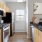 a kitchen with wooden cabinets
