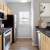 a kitchen with wooden cabinets