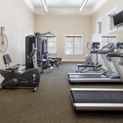 Everything within reach a room with exercise equipment