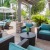 a patio with chairs and umbrellas