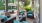 a patio with chairs and umbrellas