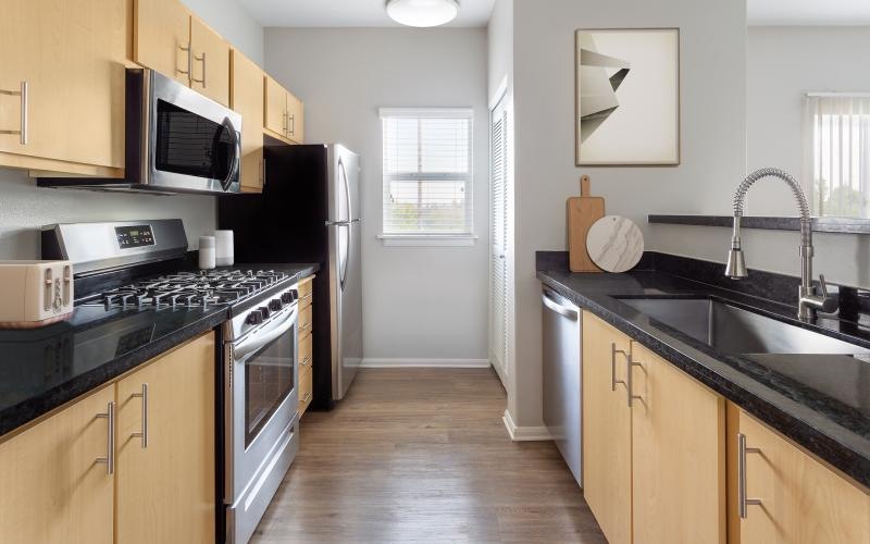 a kitchen with wooden cabinets