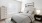 a bedroom with a fan